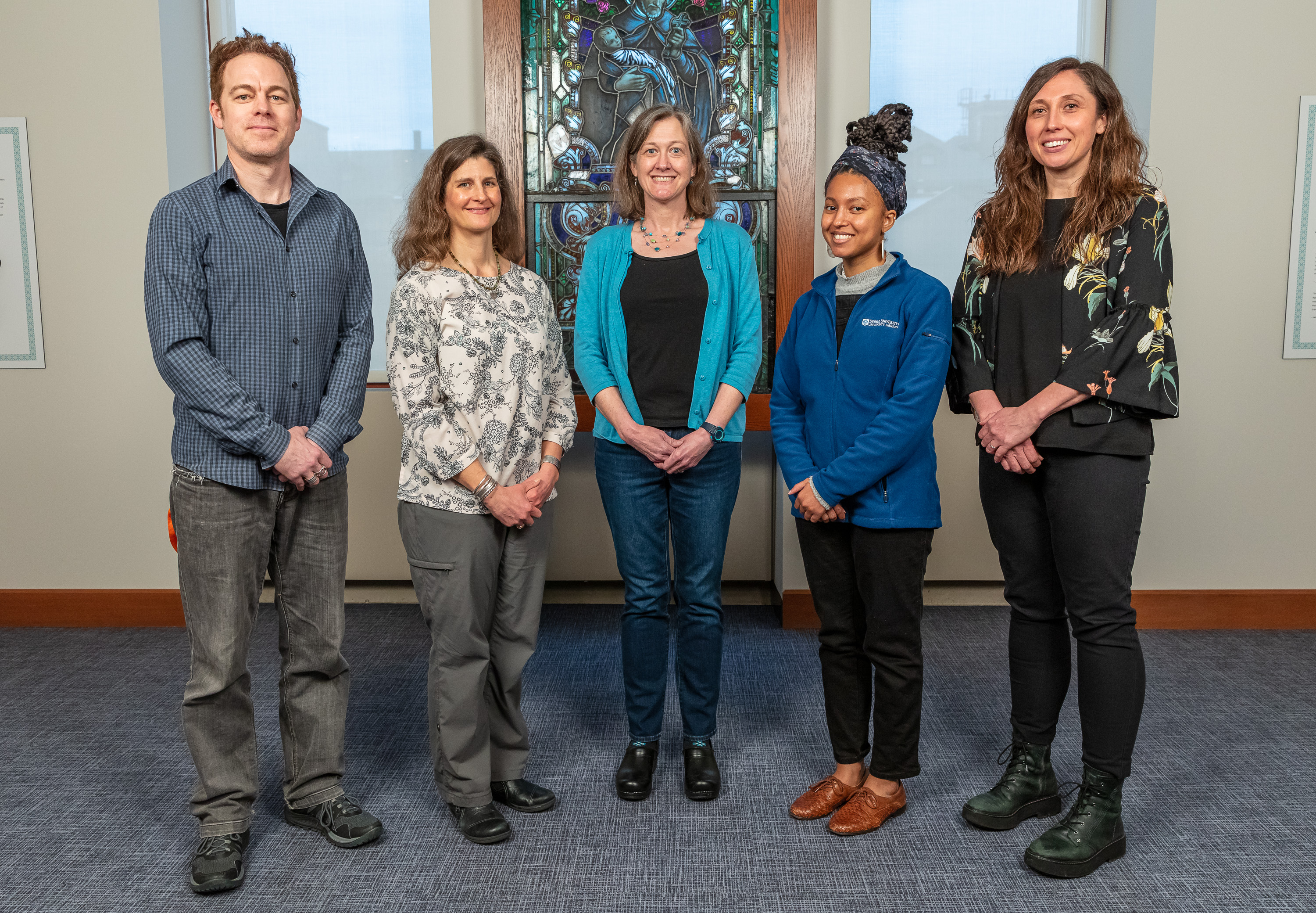 (Left to right) Derek Potts, Morgen MacIntosh Hodgetts, Jamie Nelson, Rebekah Otto and Brittan Nannenga serve on the special collecion and archives team in the DePaul University Library. These staff collect, preserve, and share rare books; DePaul University, Vincentian, and community archives; and maps with the DePaul community. This team also authors Newsline's Into the Archives column. Not pictured: Nora Gabor. (DePaul University/Randall Spriggs)